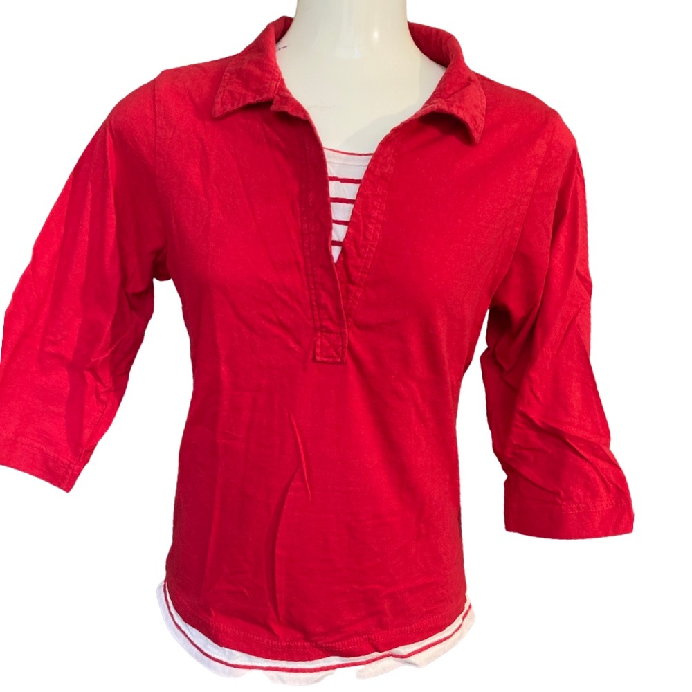Bright red collared top.